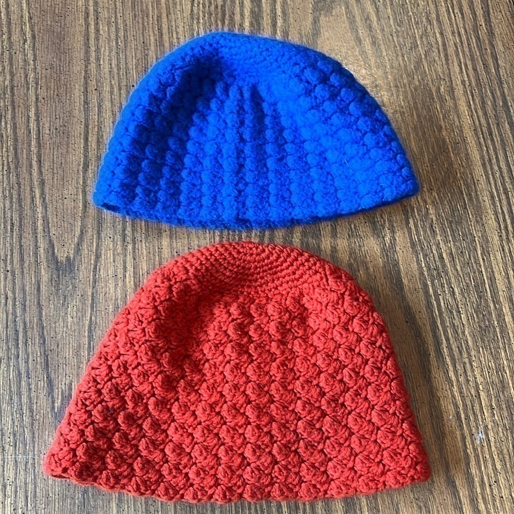 2 vintage, handmade crocheted blue and orange hats